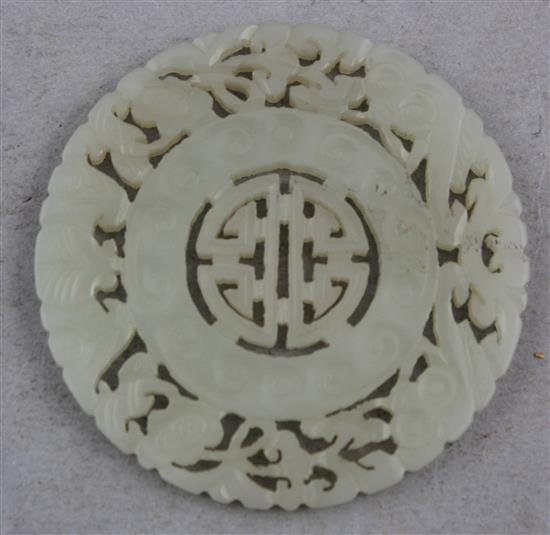 A Chinese pale celadon jade disc, 19th century, 5.5cm.